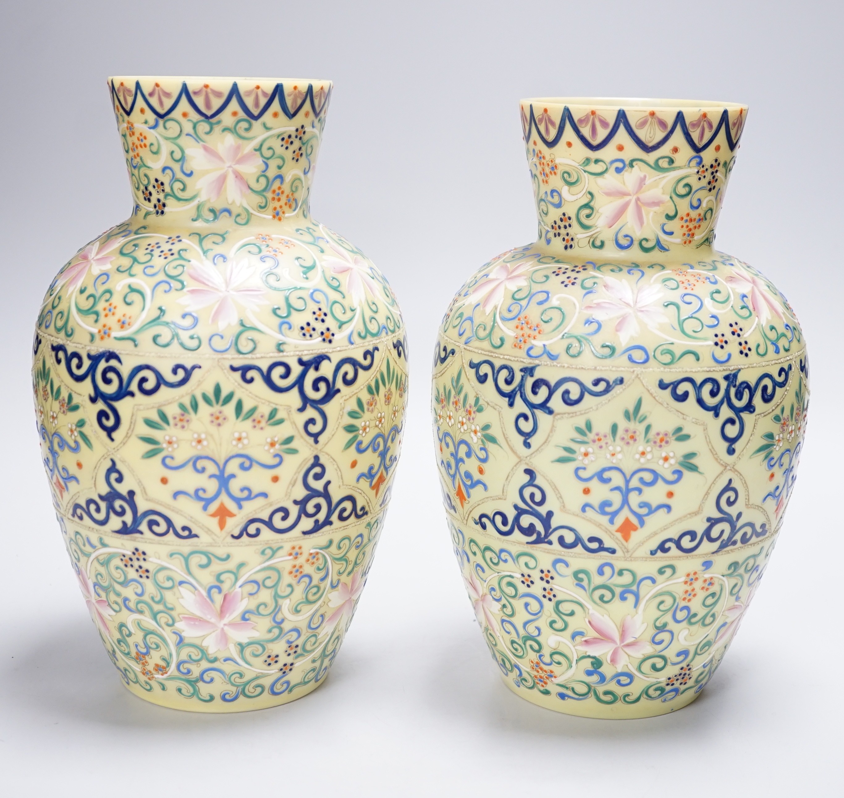 A pair of French enamelled glass vases, Persian inspired, 25.5cm